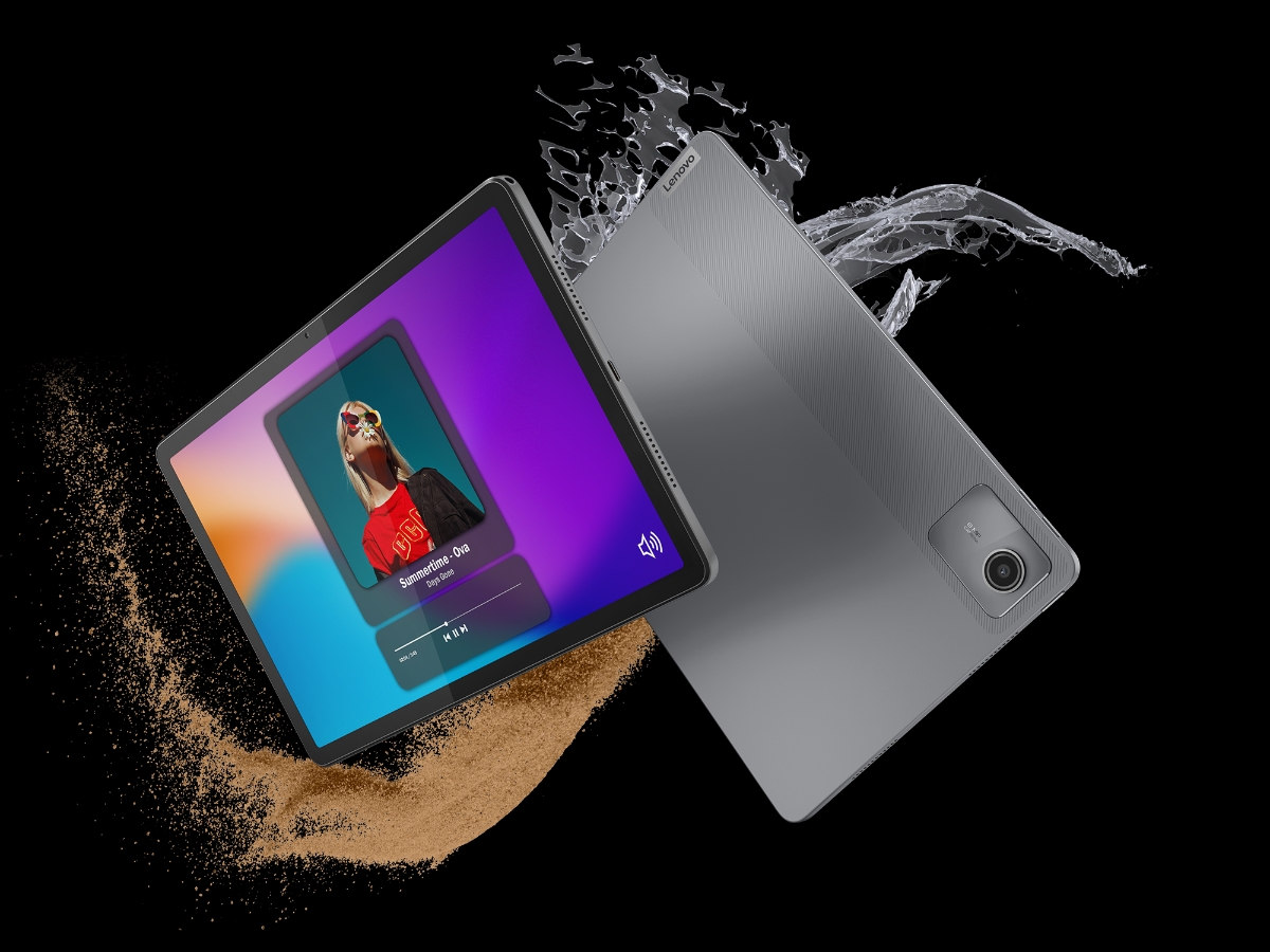 Lenovo Tab M11 with water splashes and sand to demonstrate durability