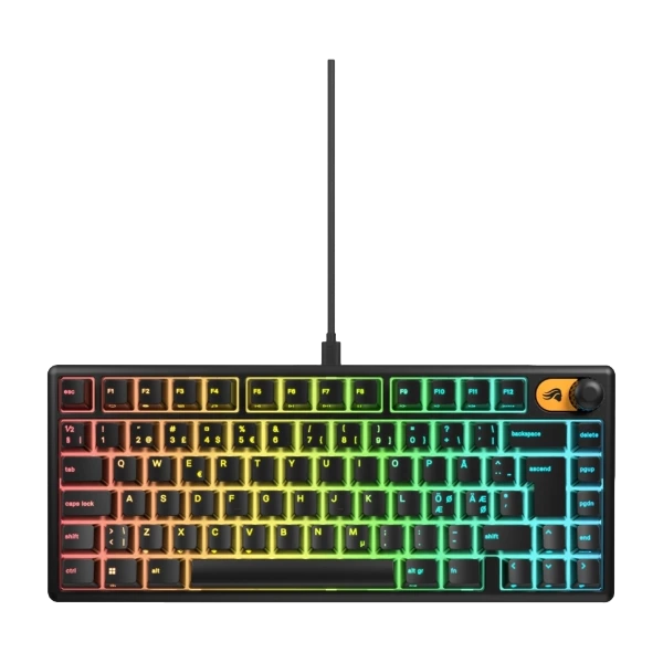 Nærbilde av et GLORIOUS GMBK 75% Membrane Keyboard i svart, med levende RGB-bakgrunnsbelysning på tastene. Tastaturet har en kompakt layout med synlige funksjonstaster og en fremtredende kontrollknapp øverst til høyre. Tastene viser standard alfanumeriske tegn og symboler, belyst i en regnbuegradient.