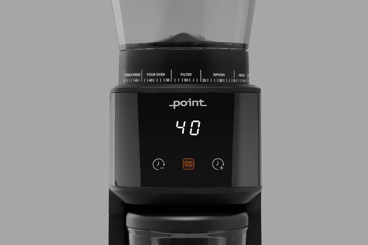 A black Point Pro coffee grinder pictured up close with its screen on and a grey background