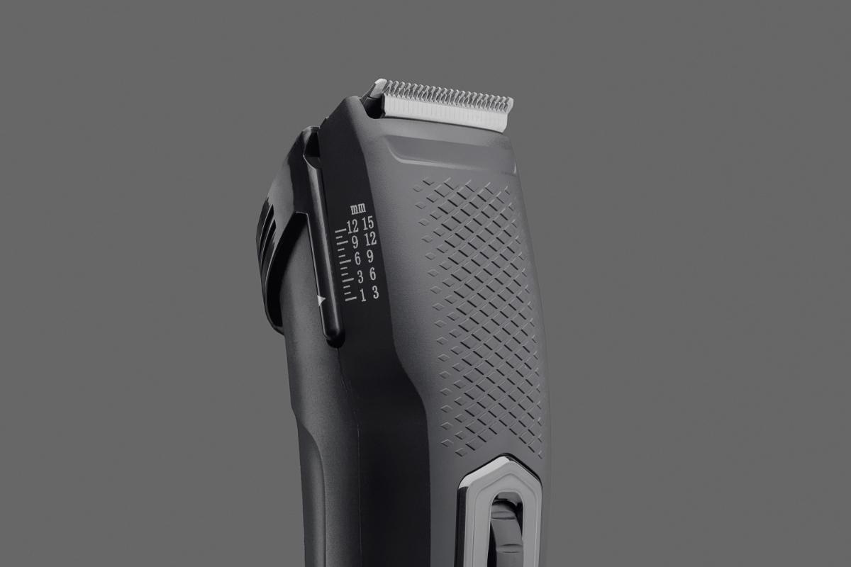 Close up of the cutting blades of POINT STYLE HAIR CLIPPER SET against dark grey background