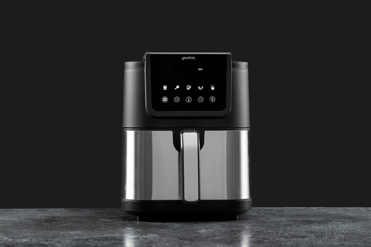 Airfryer on the grey surface and black back ground