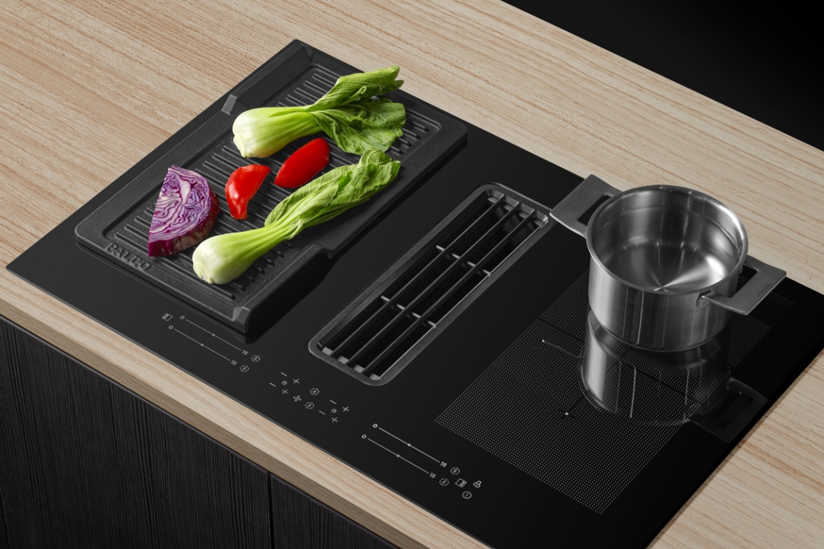 Pot and vegetables on induction hob.