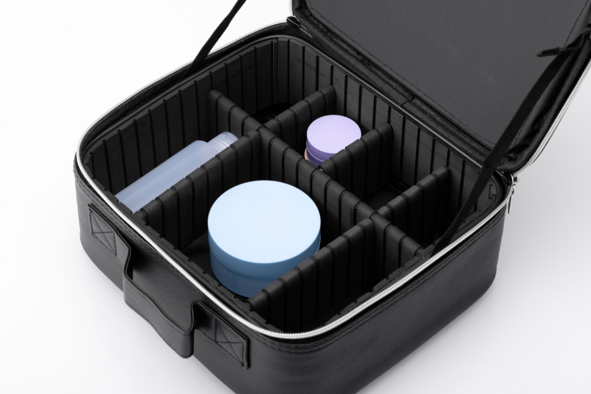 Close up of the adjustable dividers of NOOA VANITY MAKE UP TRAVEL BAG from above