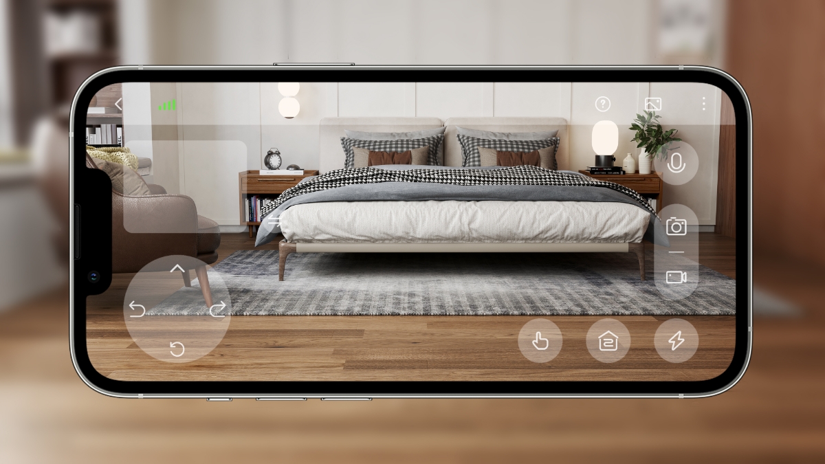 En bild av Dreamehome-appen på en smarttelefon med videon från övervakningskameran på Dreame-robotdammsugaren som visar ett sovrum
