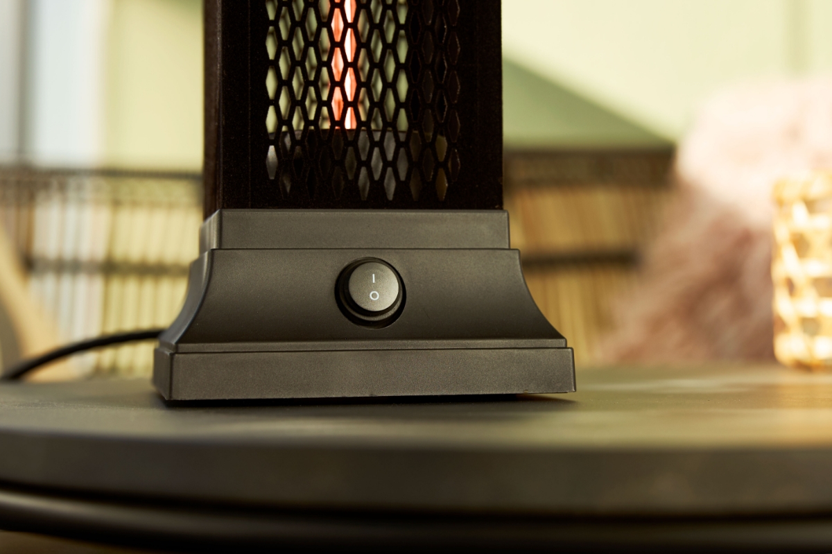 Close up of the power button of POINT PRO POPHTOW53 patio heater, on a table