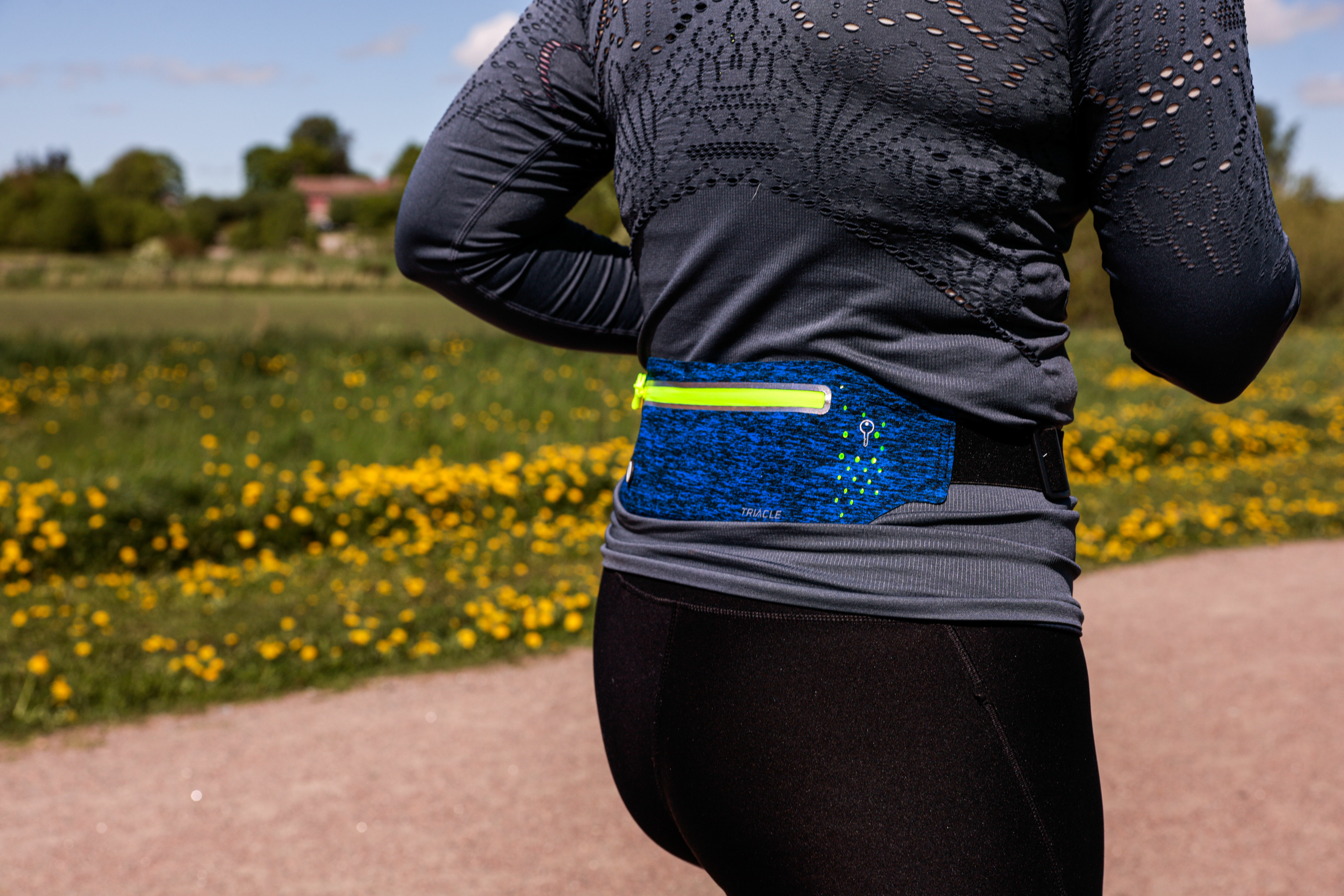 Woman running with Triacle waist bag