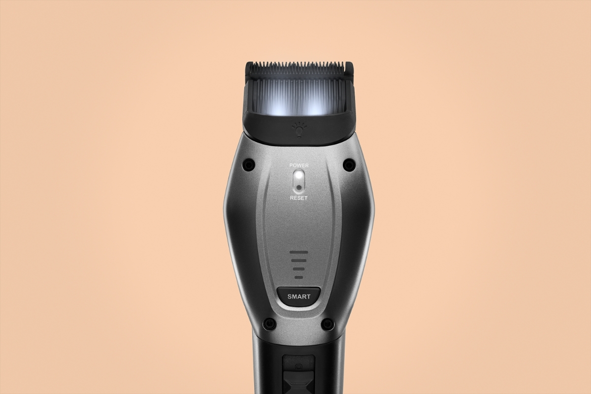 POINT PET GROOM PET TRIMMER Silver and black Point Groom trimmer against a beige background