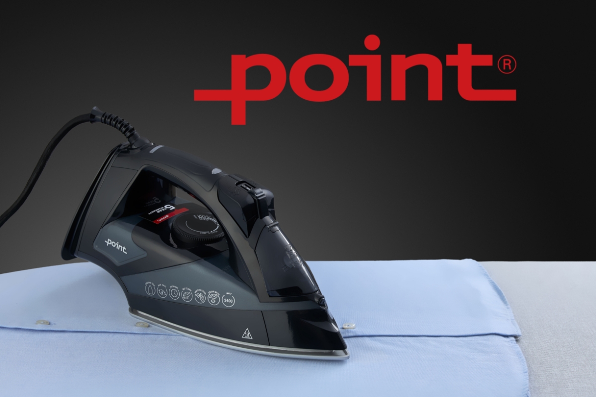A picture of a black Point steam iron on an ironing board steaming a light blue collar shirt and a Point logo above the device