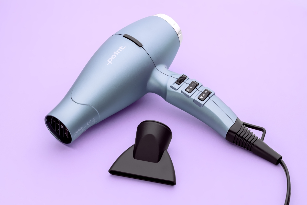 POINT POHD897AC RADIANT BLOW HAIR DRYER and its concentrator nozzle against a purple background