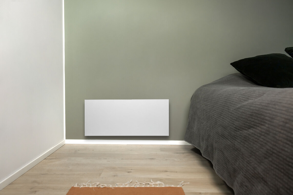 Panel heater on the bedroom wall