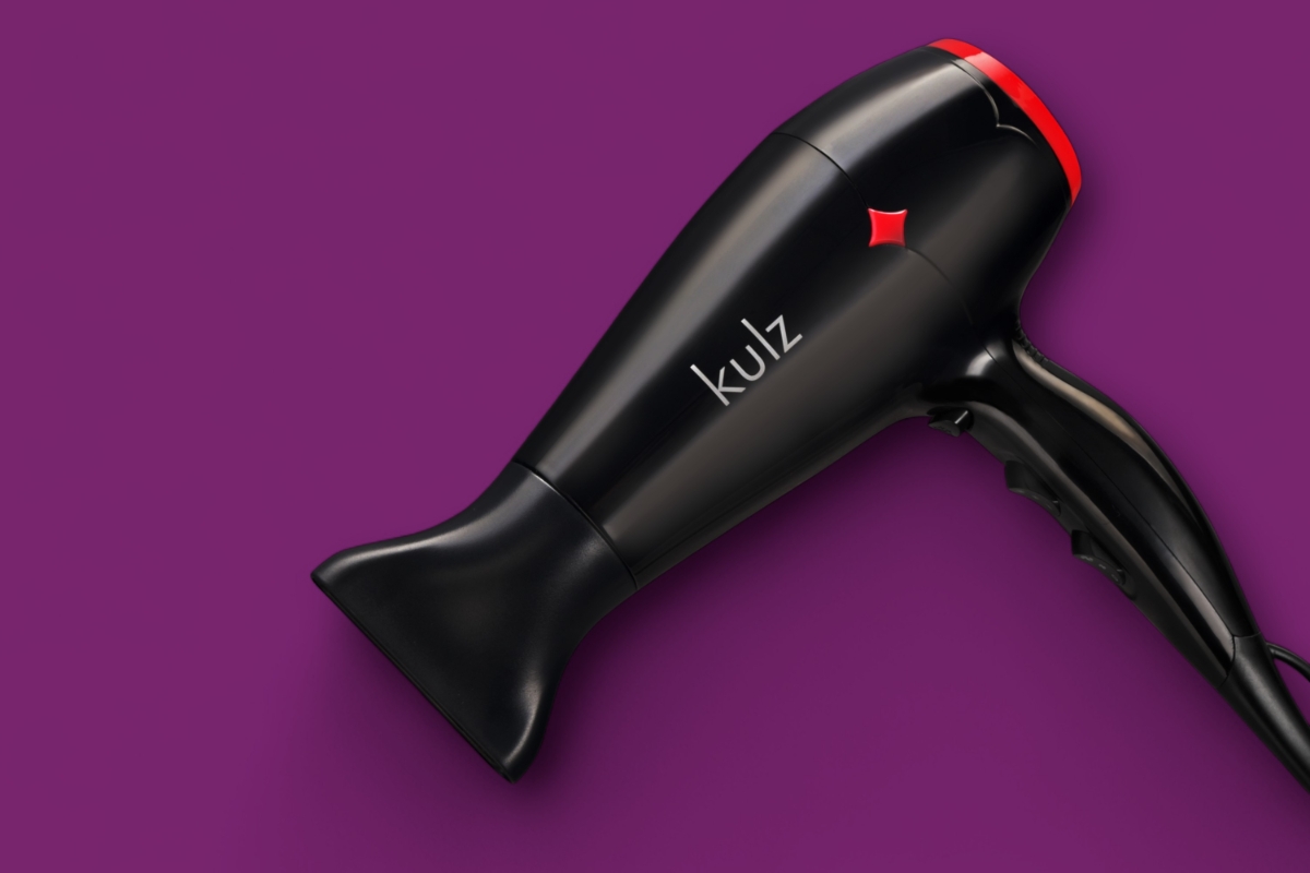 Close up of KULZ EASY DRY HAIR DRYER against fuchsia background 