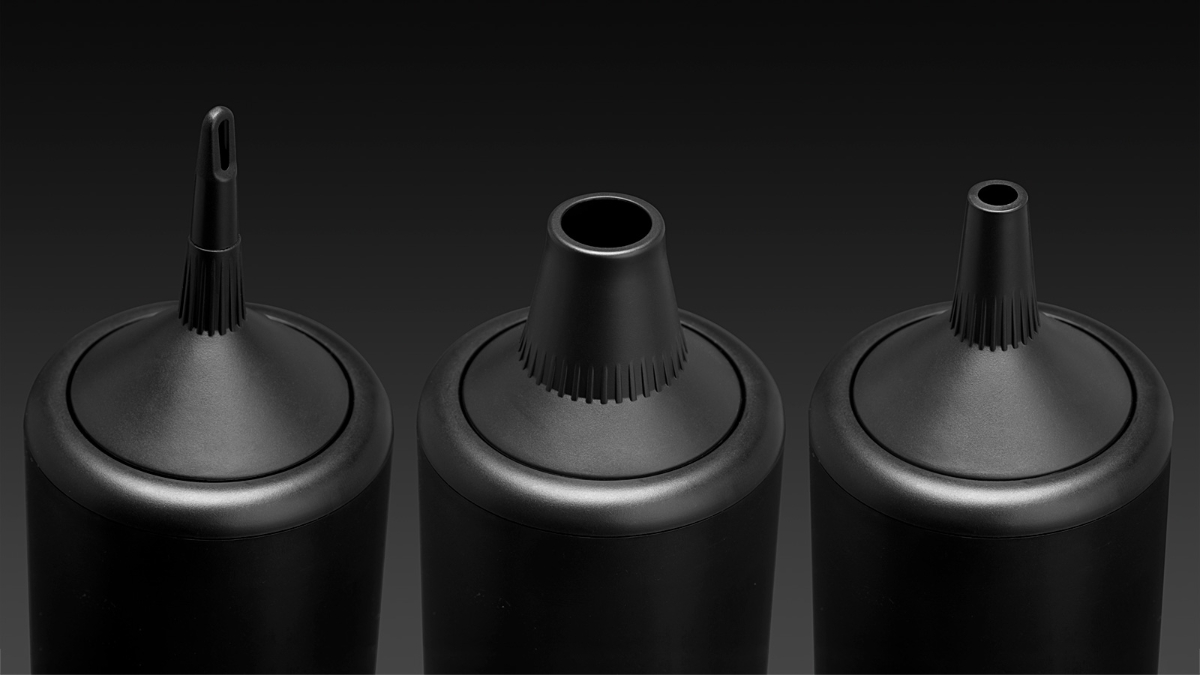 The three different sized and black-colored blow hoods of the Point Tornado handheld vacuum cleaner in a row with a black background