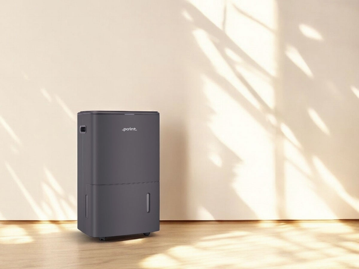 POINT PODHAP20G DEHUMIDIFIER/AIR PURIFIER against a beige wall with some shadows cast on the wall