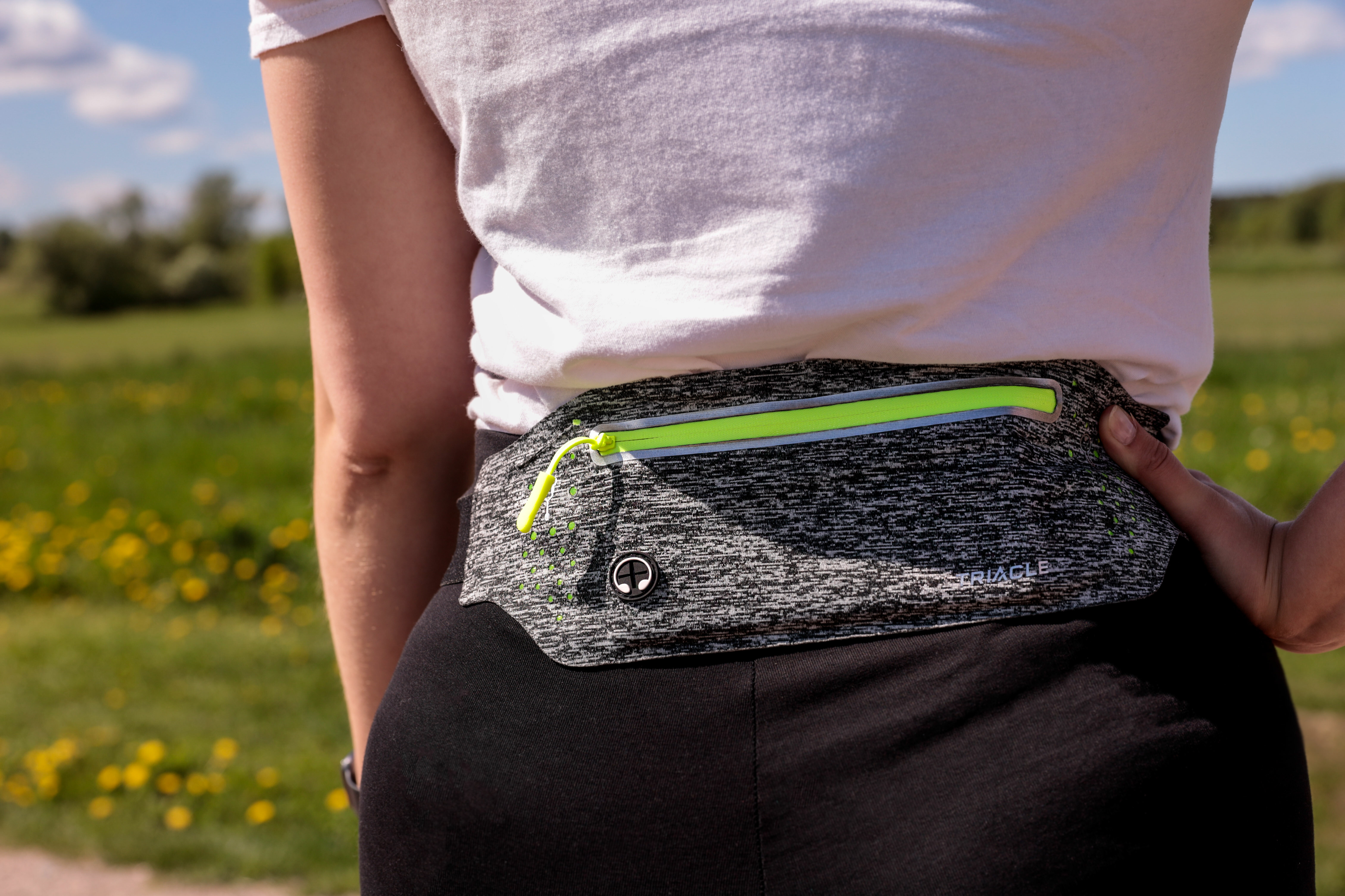 Woman wearing a Triacle waist bag