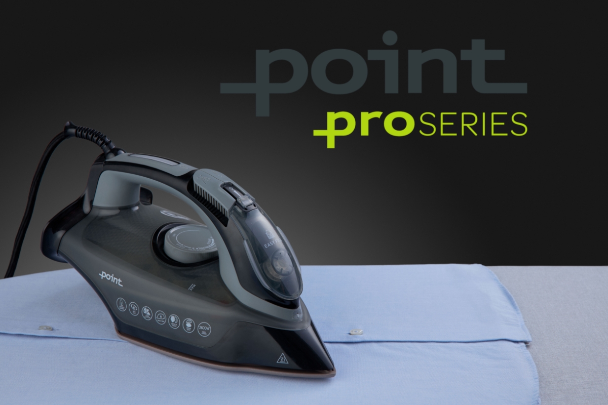 A black Point steam iron ironing a light-blue collar shirt and a Point Pro Series -logo on top of the device