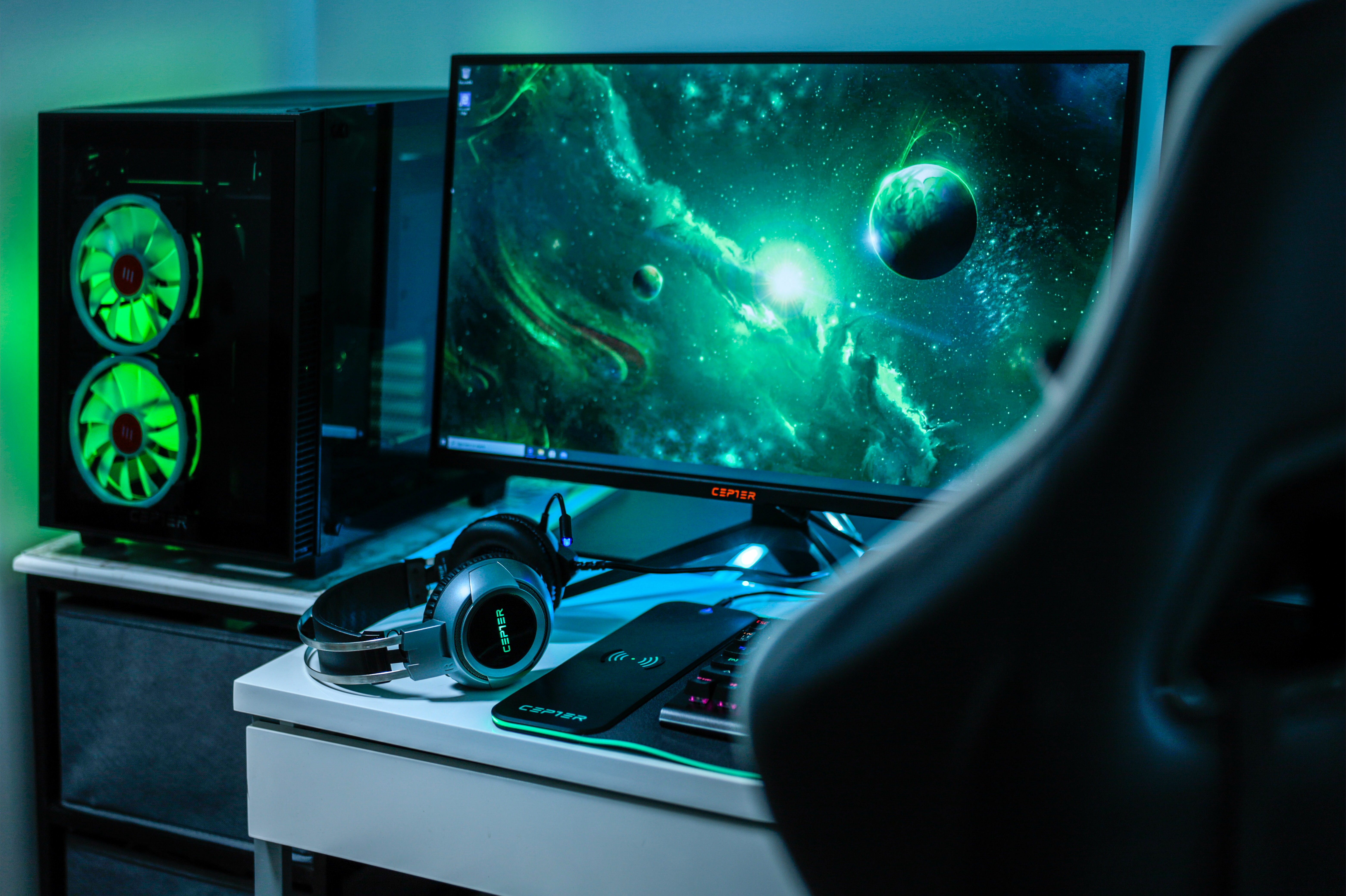 Gaming setup with green-lit Cepter Carapace Cube